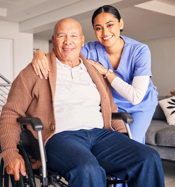 Caregiver with senior man in wheelchair