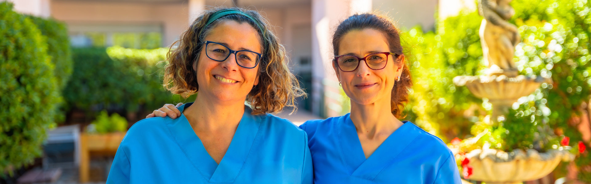 Two caregivers smiling